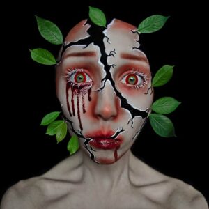 woman broken face crying tears of blood with leaves growing from her face